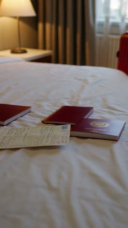 hotel room with documents on bed