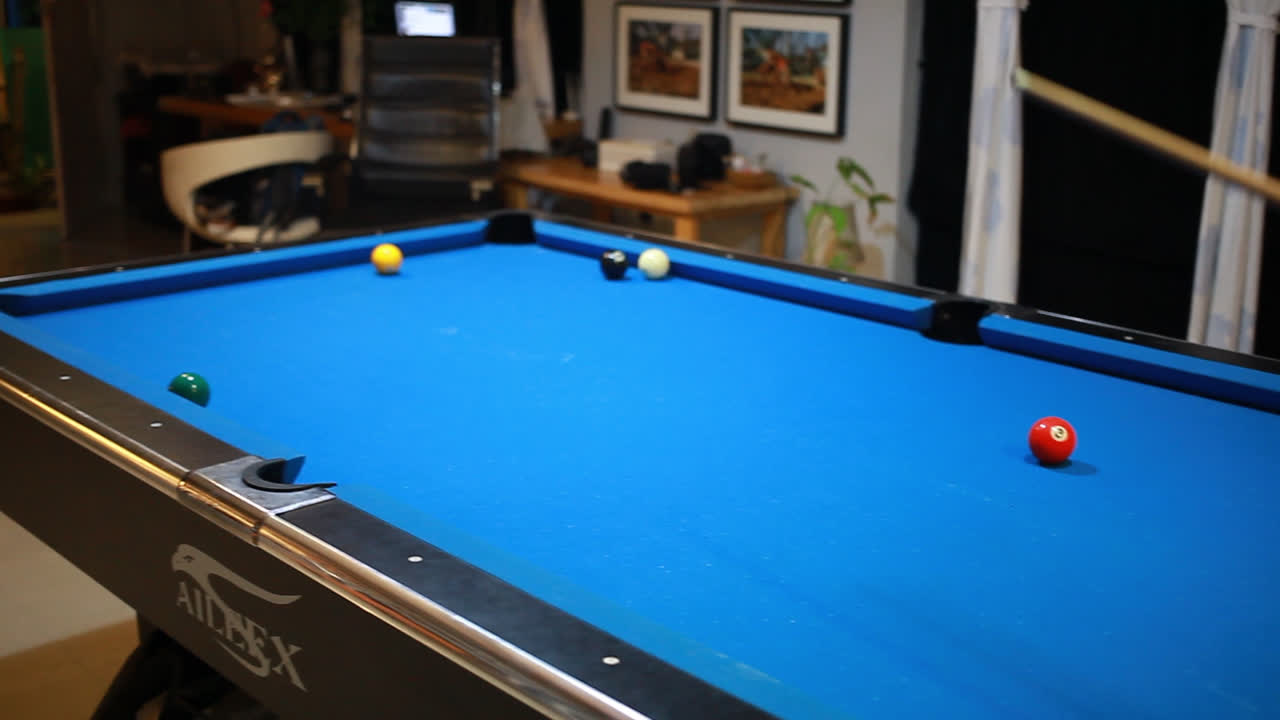 handsome man playing pool game