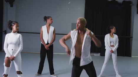 mixed race modern male dancer wearing practicing a dance routine