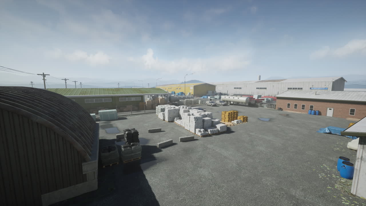 un gran almacén industrial con un camión estacionado delante de él