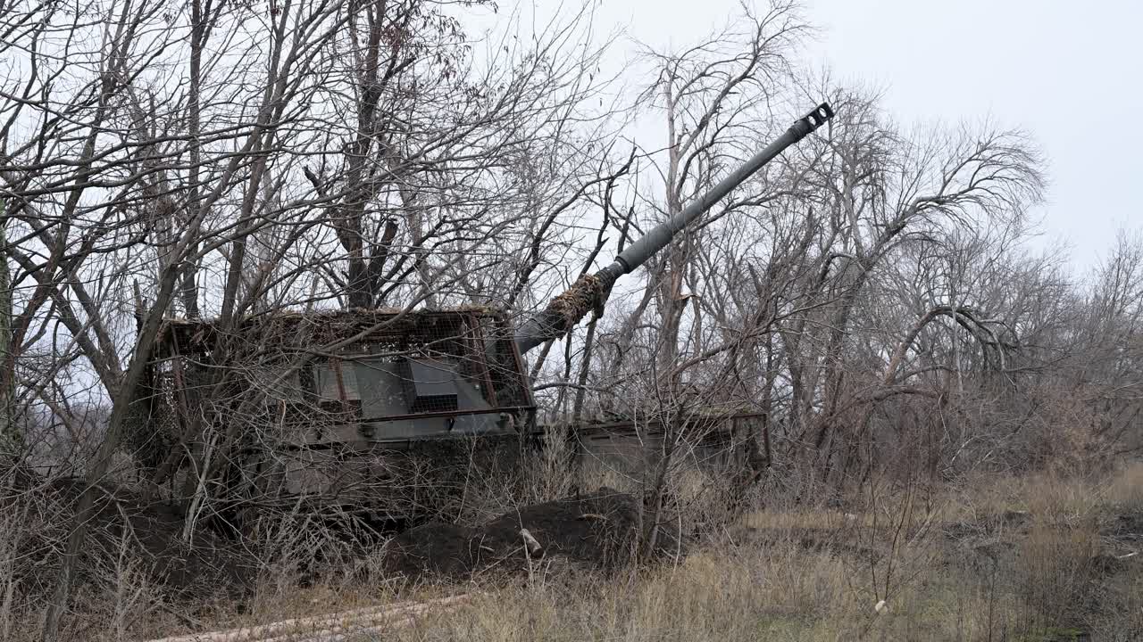 A Ukrainian PzH 2000 self-propelled howitzer is aimed and ready to fire from a concealed position. This German-made artillery is a key asset for striking Russian targets