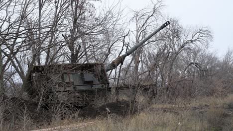 a ukrainian pzh 2000 self-propelled howitzer is aimed and ready to fire from a concealed position. this german-made artillery is a key asset for striking russian targets