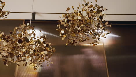 suspended pendant chandeliers with shimmering gold metal discs