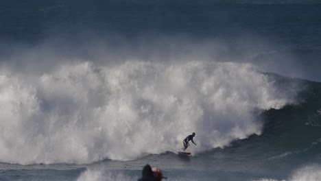 the surfer is caught on the wave by the foam and after a short ride falls