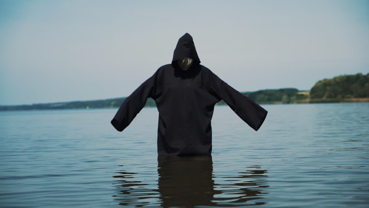 Terrible witch on the river bank. Mysticism of Halloween