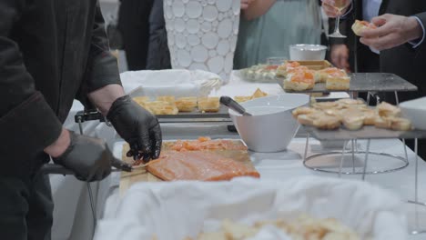 meat cutting and serving of canapes refreshment in corporate party