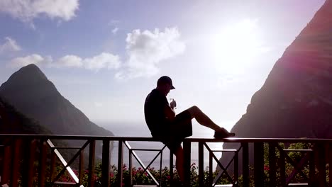 A-Man-Sits-On-A-Balcony-Of-A-Luxury-Hotel-Room-At-St-Lucia-Caribbean