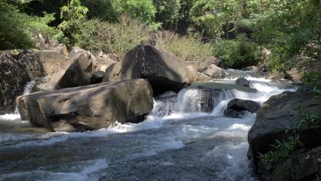 water waves and streams from waterfall flowing in slow motion