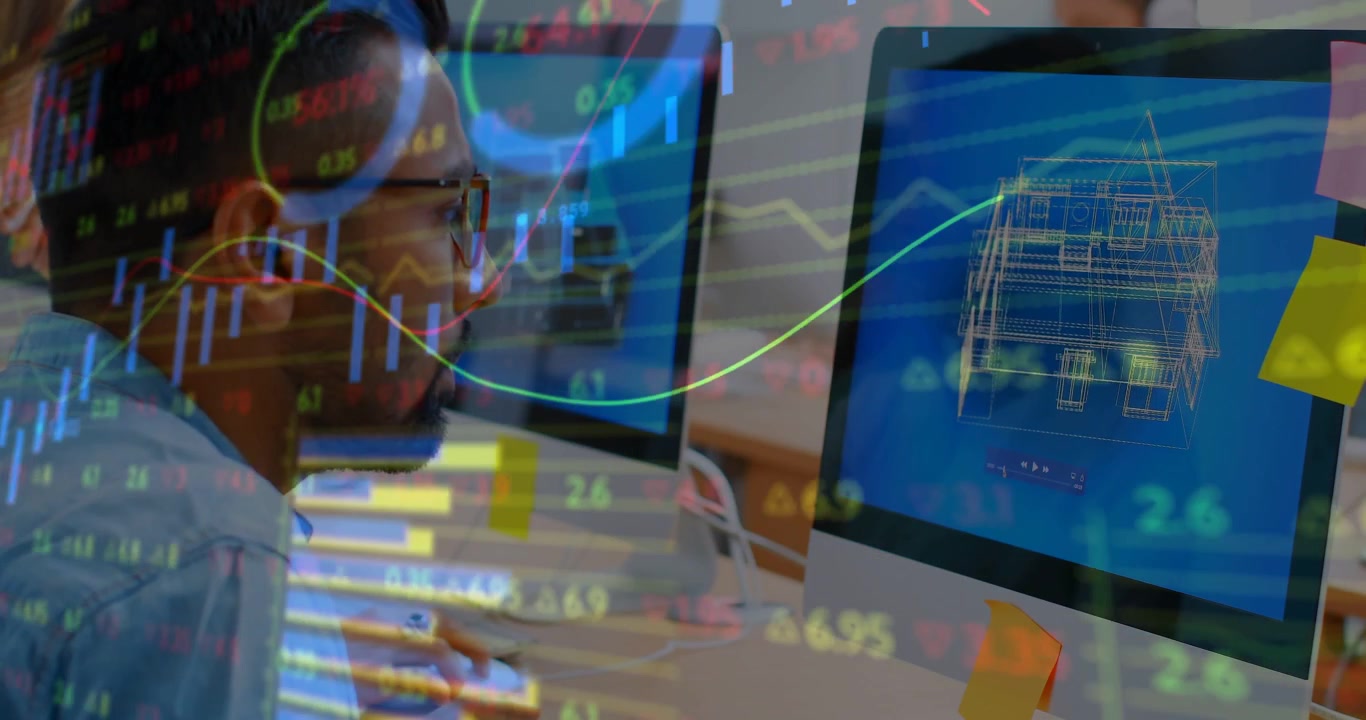 Designer leaning at desk, pulsing market tickers on wireframe causing typing to analyze data