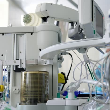 Anaesthesia machine ventilator. Medical equipment for saving patient&#039;s life in the operating room on the blur background of doctors. Close-up