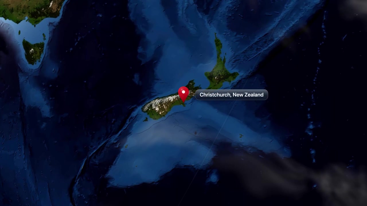 Satellite view zooms from planet Earth to Christchurch, New Zealand with a location pin marker. Includes NASA public domain imagery.