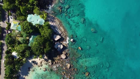 aerial view of beautiful costal waters and homes in the seychelles