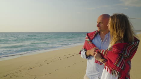 Pensive-young-couple-looking-at-seaview