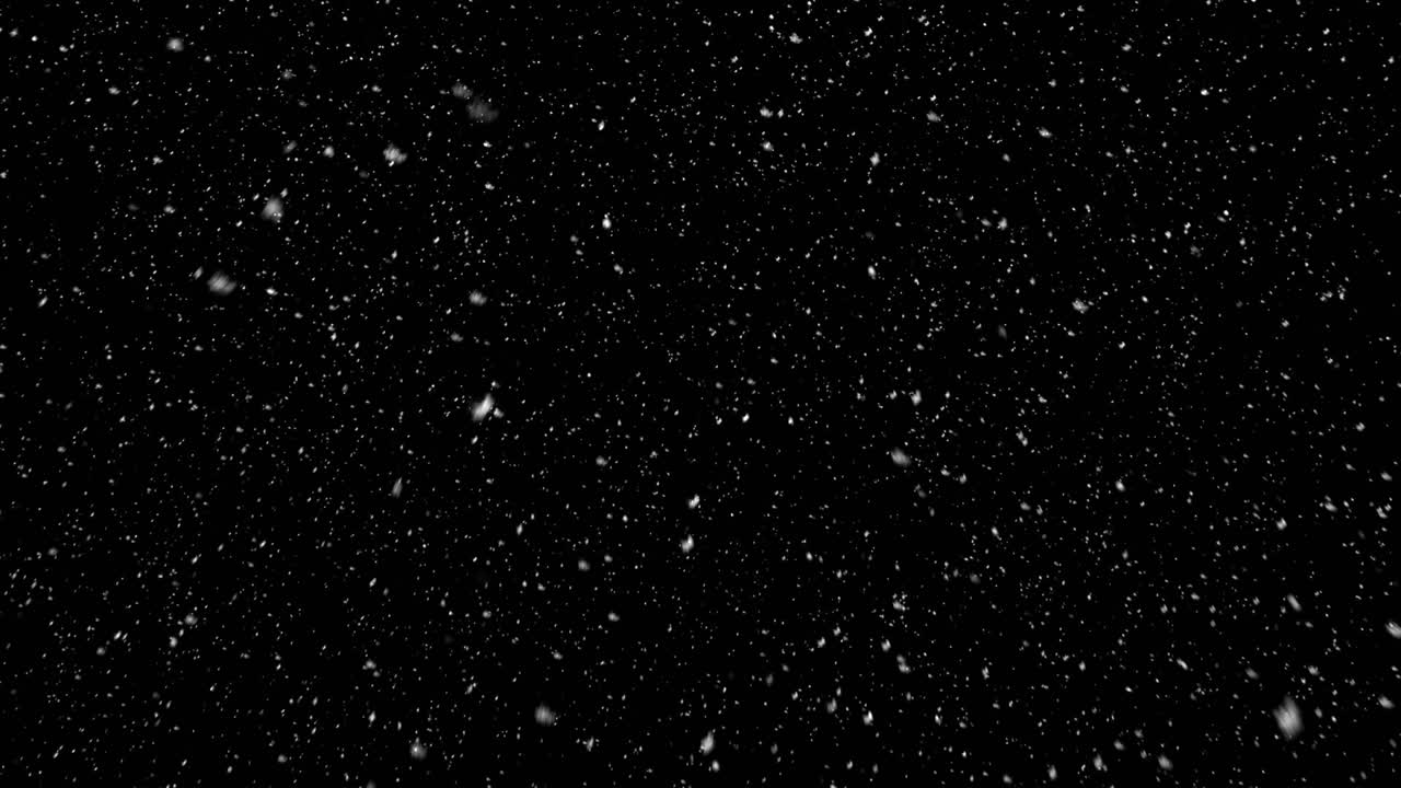White snow particles fall slowly against black background. Perfect for winter, Christmas, or calm atmospheric overlays. Seamless loop