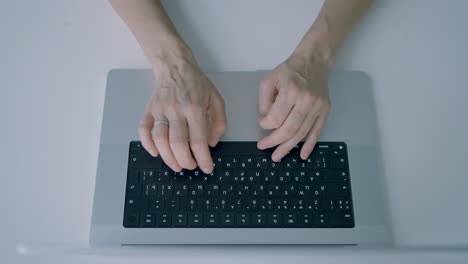 person typing on a laptop