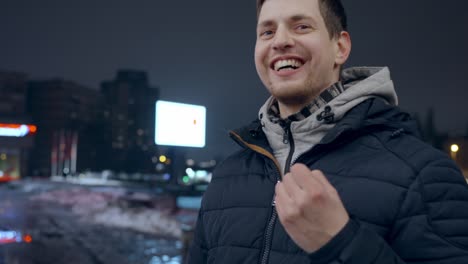 italian man talking to the camera using hand gestures, outdoors in city