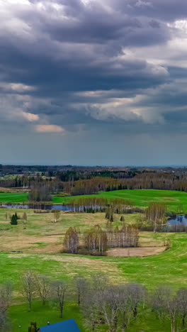 Gloomy timelapse of dark clouds bringing rain over the empty park