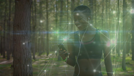 animation of network of connections over woman exercising in forest