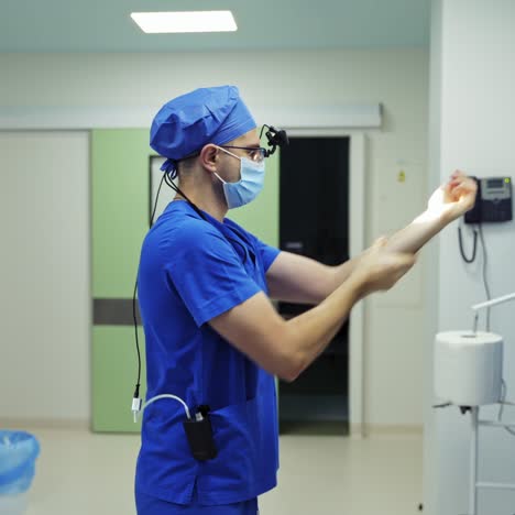disinfecting hands. male doctor sterilizing his hands. measures to prevent spread of covid-19 virus. protection against coronavirus.