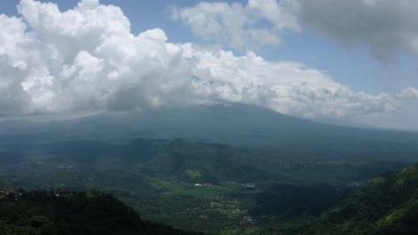 clouds over mountain and towns in bali indonesia