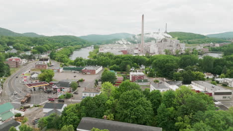 orbiting pan-up of rumford maine downtown, gas station, and paper mill