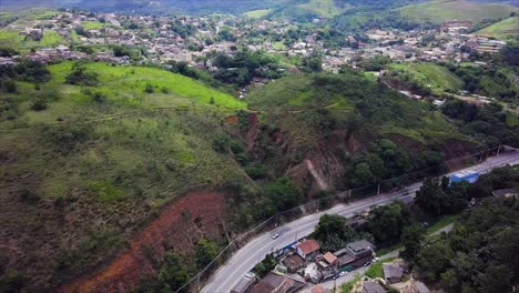 Slow-aerial-pan-showing-hill-erosion-by-road-in-Mendes,-Rio-de-Janeiro