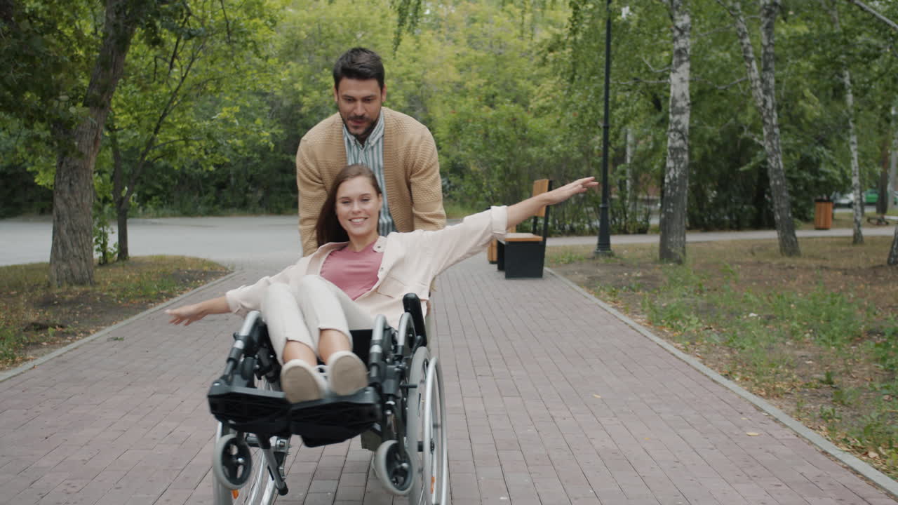Couple in Park with Wheelchair