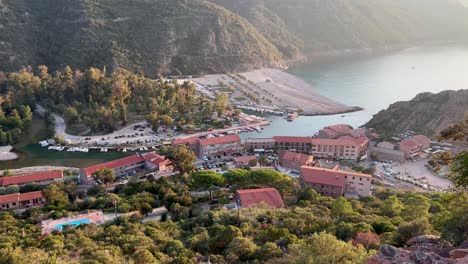 aerial panoramic view of porto ota town at sunset with genoese watchtower in corsica, france