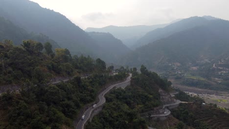 drone view of traffic on the bp highway, bardibas highway, in the mountains of nepal