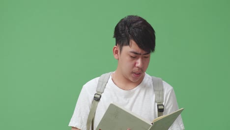 young man reading a book