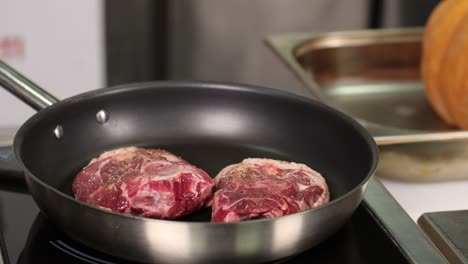cooking lamb chops in a pan