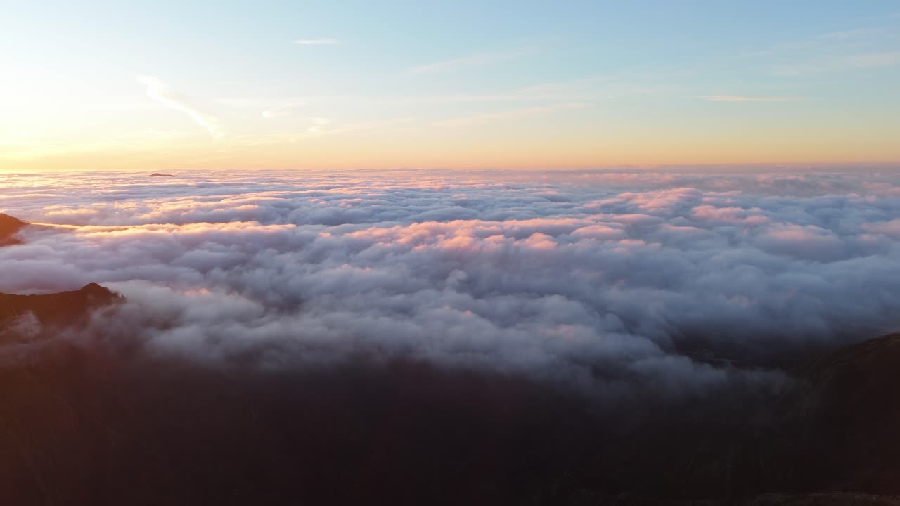 Sunset over clouds with mountains in genoa, italy, serene and majestic, aerial view