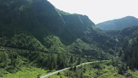 drone view of a road running through of sölktäler mountain valley in styria, austria