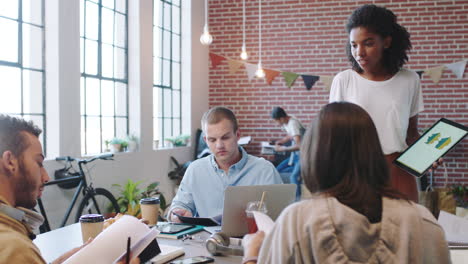 logo, tablet and graphic designer in a meeting