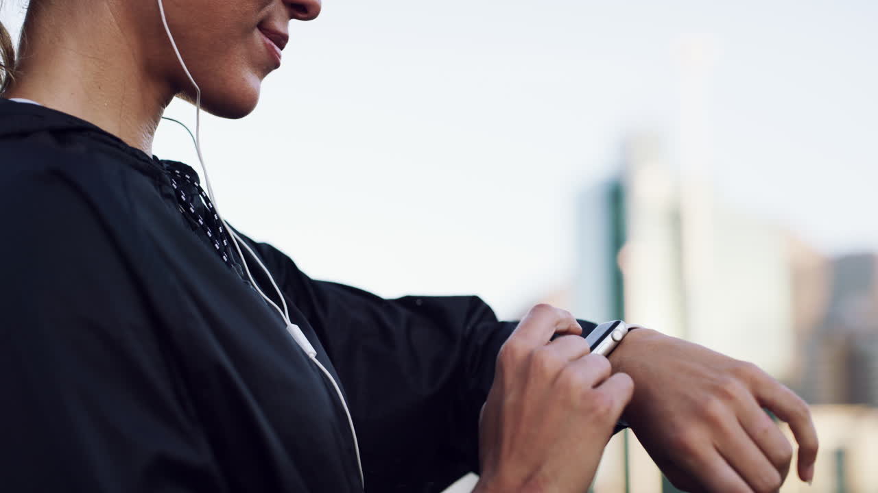 a young woman checking the time during a workout