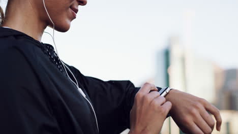a young woman checking the time during a workout
