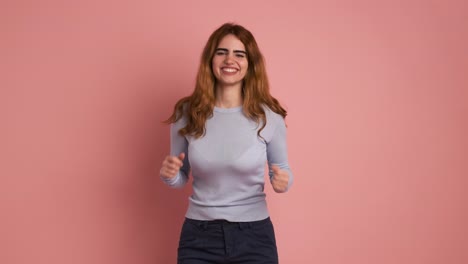 surprised woman smiling at camera and celebrating