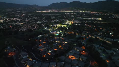 Aerial-View-of-Santa-Clarita-Neighborhood-of-Los-Angeles-CA-at-Night,-Lights,-Streets-and-Buildings