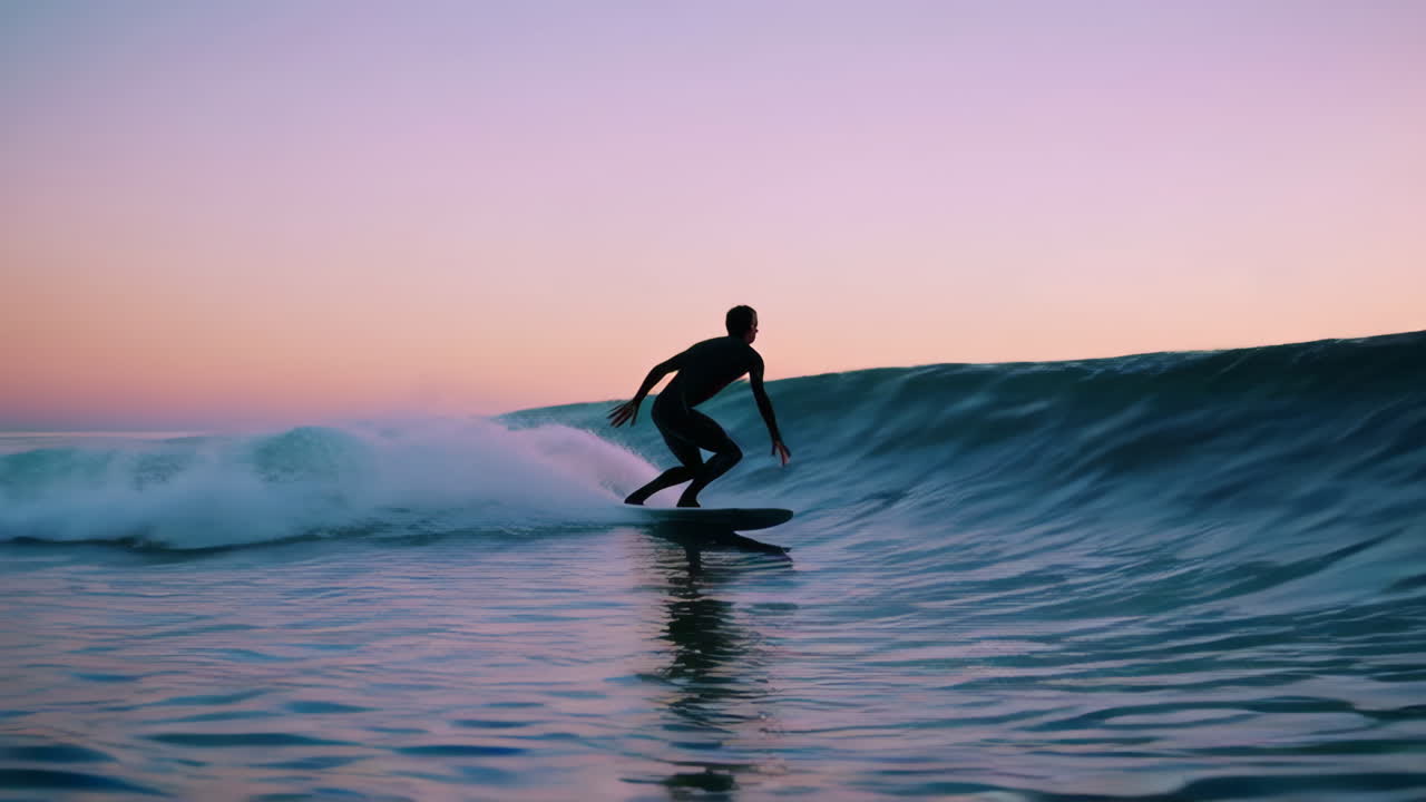 Surfer Riding Sunset Waves