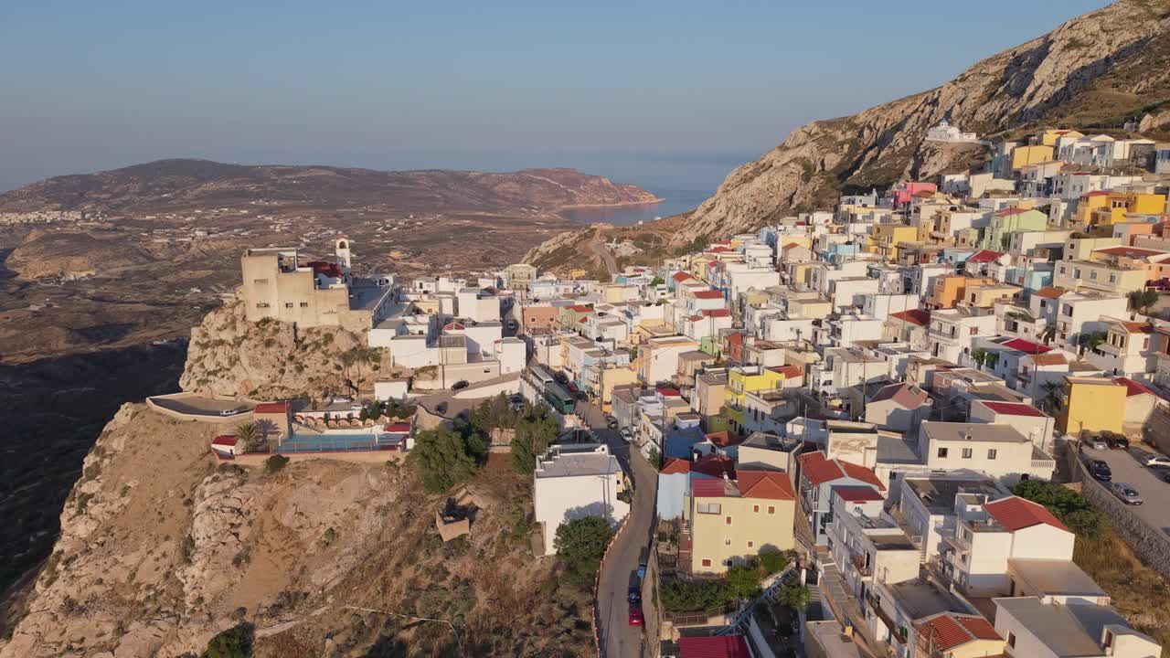 Drone approaching Menetes Village on Karpathos Island, Greece — revealing its beauty, colorful houses, and traditional Mediterranean charm