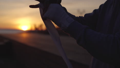 athlete preparing for boxing at sunset