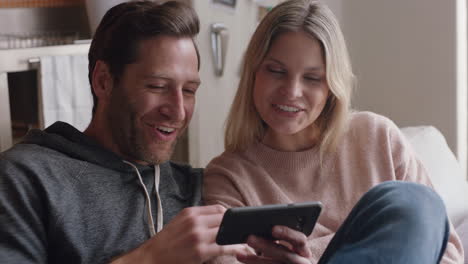 happy couple having video chat using smartphone chatting to friend smiling excited enjoying online communication on mobile phone at home