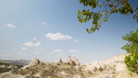 distant horse riders fairy tent rock formations red valley cappadoccia