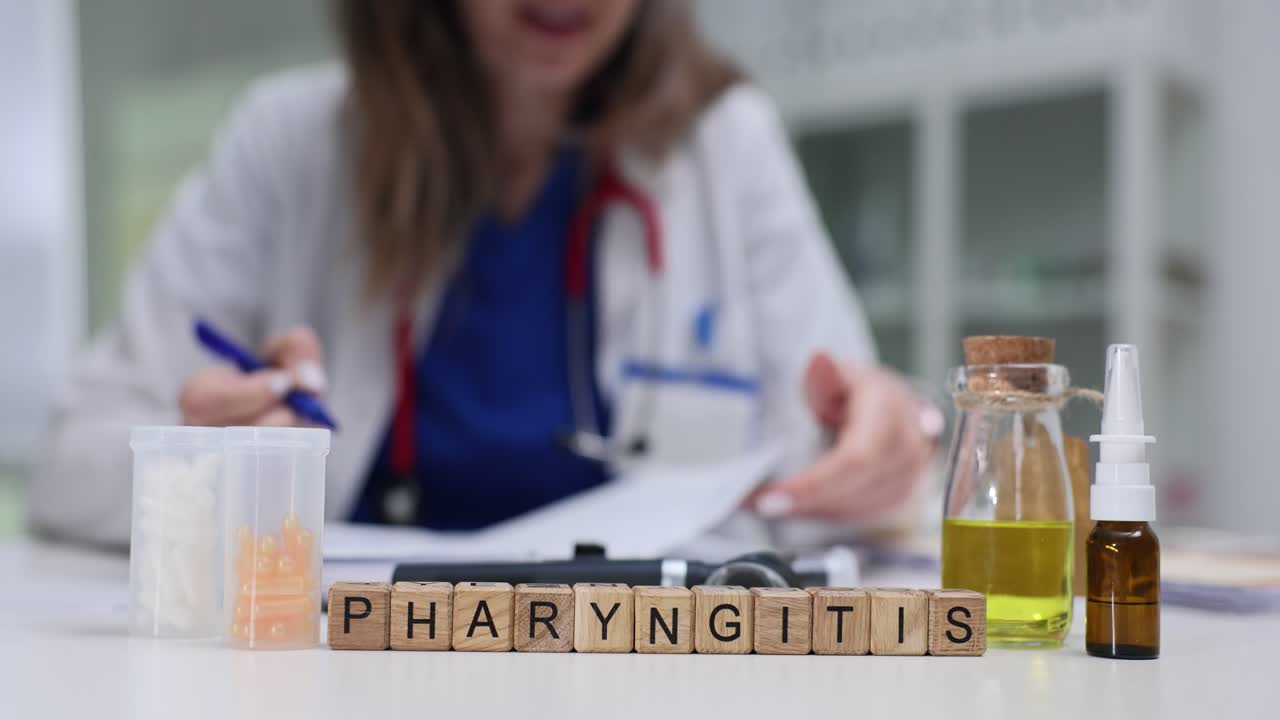 Doctor Writing Prescription for Pharyngitis with Medicines on Table