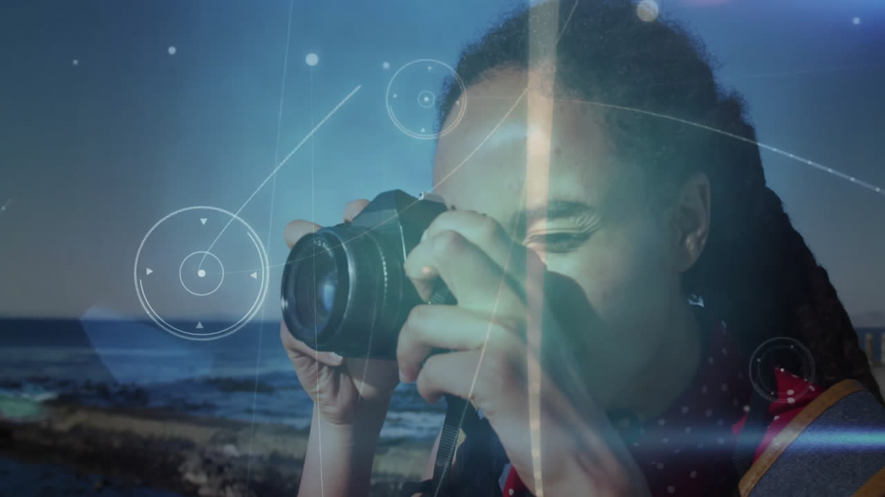 By ocean, person capturing photo with light effects and animation overlay