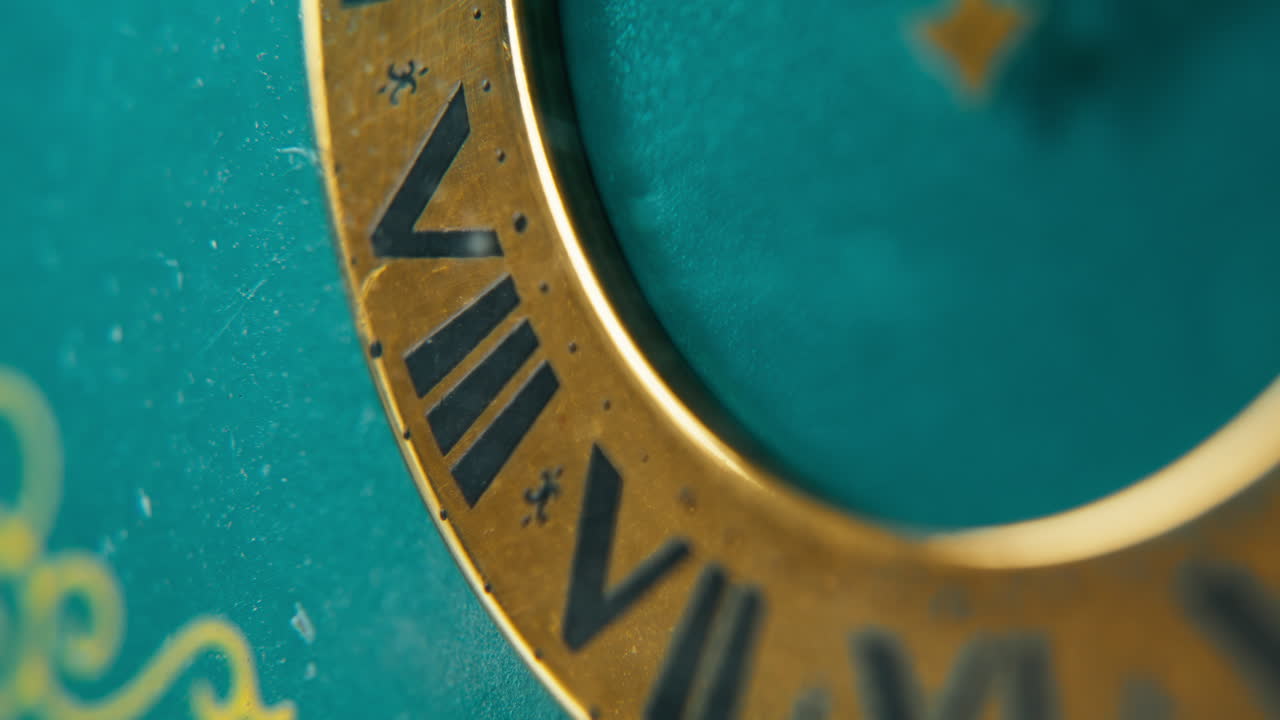 Closeup vintage clock measuring time in calm studio. Dial with roman numerals