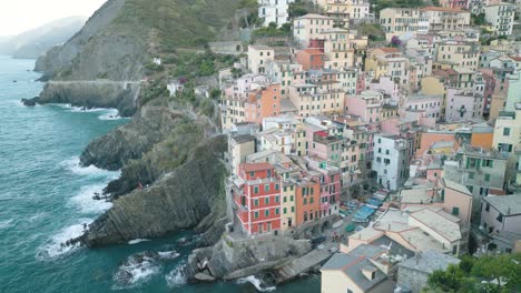 orbiting drone shot reveals riomaggiore cinque terre on beautiful summer day