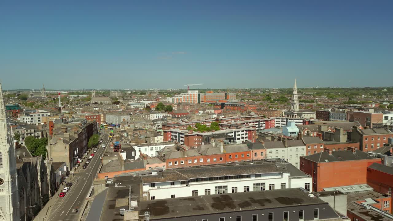 Ultra-wide advancing aerial video of Abbey Presbyterian Church and the surrounding area in Dublin City Centre, Ireland on a bright and sunny day. Filmed in 4K, 60FPS and with Rec709 color.
