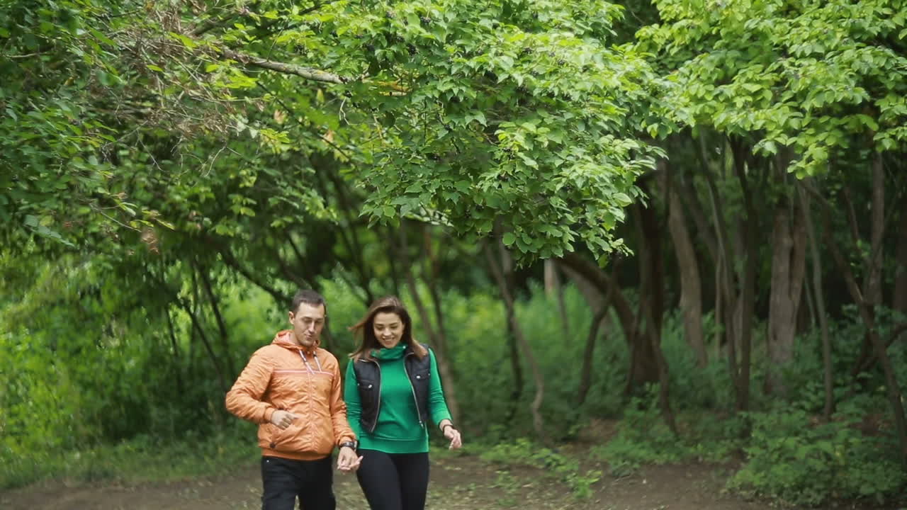 Young couple enjoying time together in nature park