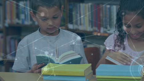 animation of network of profile icons over diverse boy and girl studying in the library at school